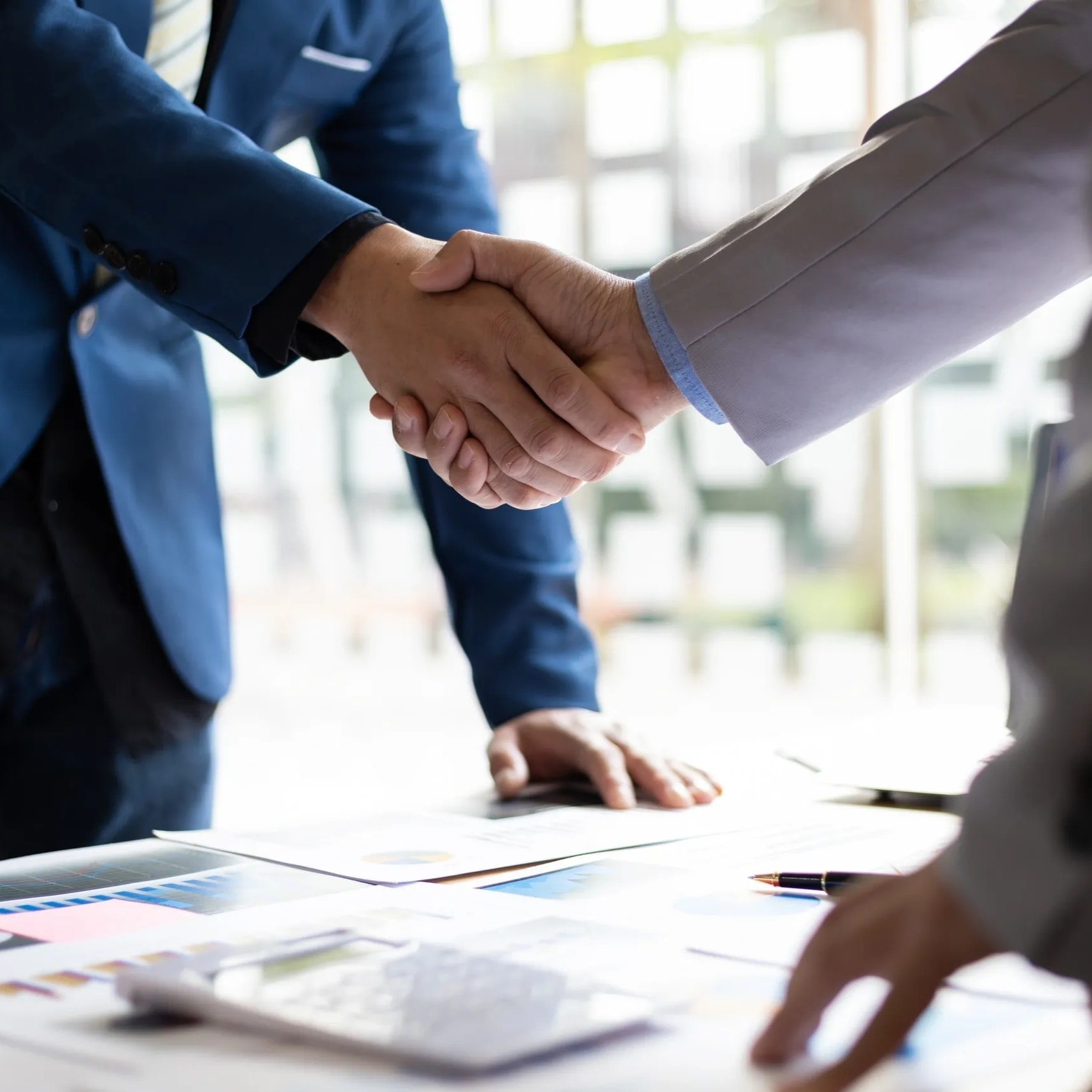 Business partnership handshake